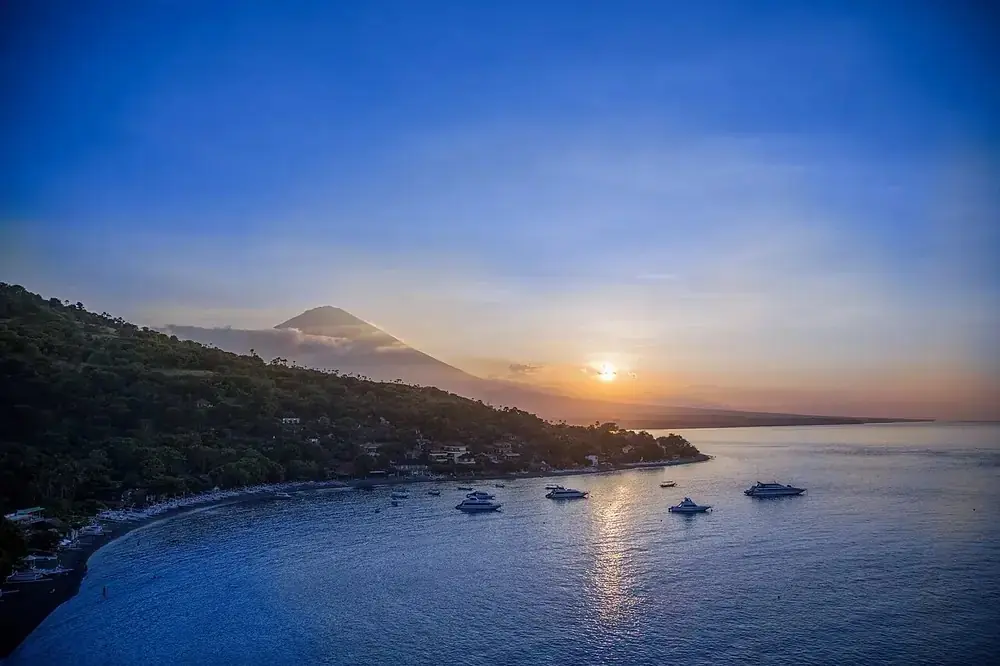 Sunset with Agung towering over the bay — Bukit Jemeluk, While you're in Jemeluk Amed