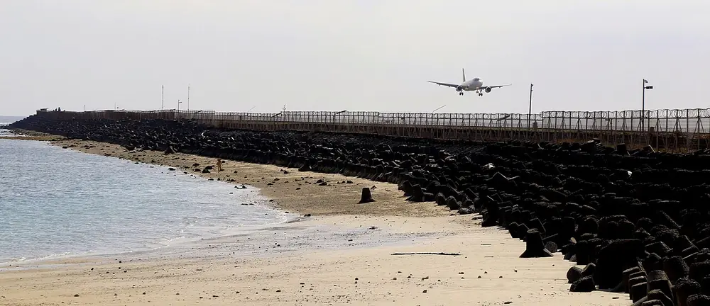 Watch planes land from the sand — Pantai Kelan, While you're in Kedonganan