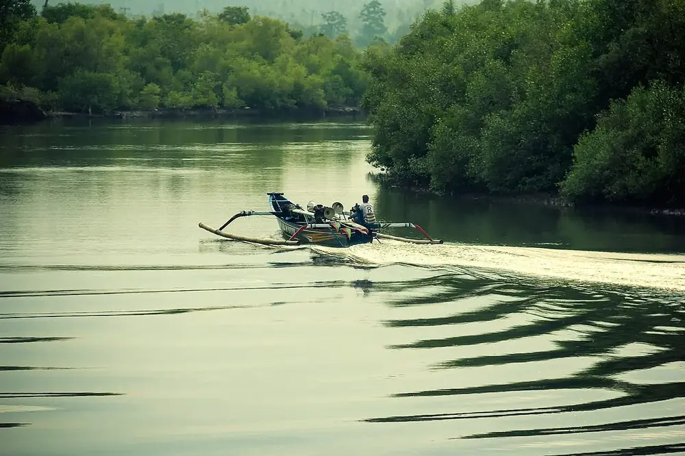 A harbour full of colourful jukung boats — Pantai Perancak, While you're in Negara